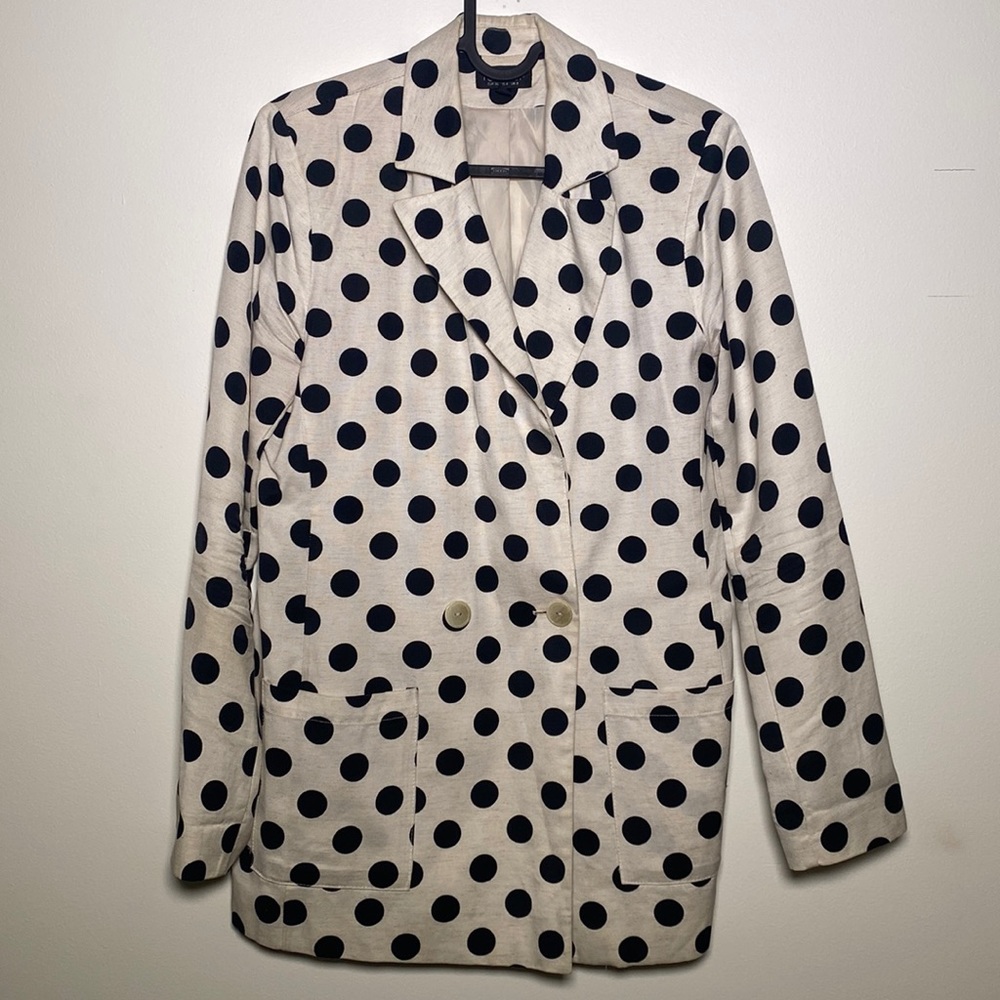 White jacket with black dots